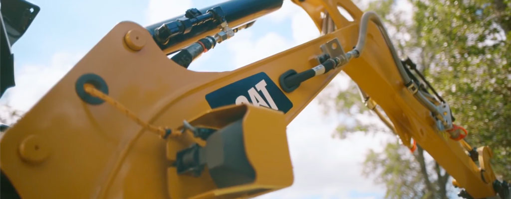 Zoom in on a Caterpillar mini excavator
