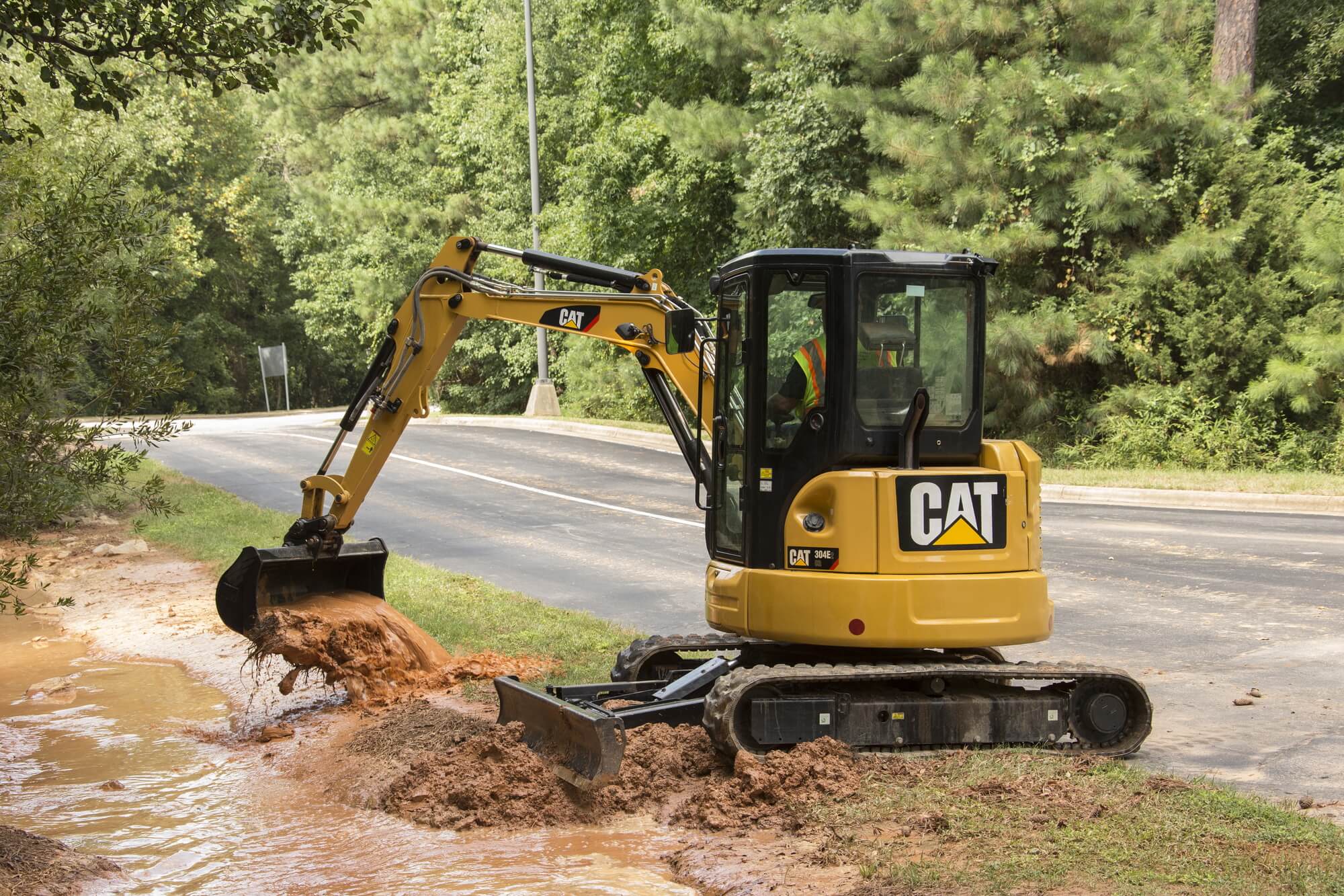 Cat mini excavator digging